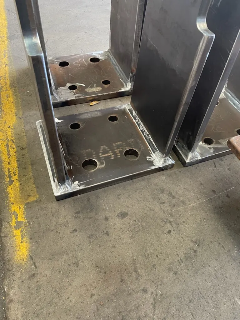 Fabricated steel base plates with fillet welds