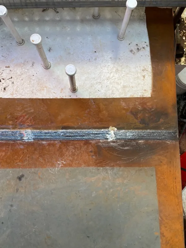 Butt weld on steel plate with shear studs