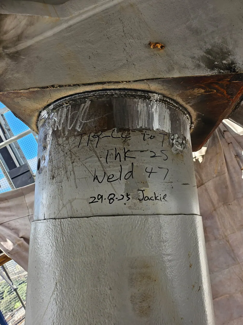 Steel column with weld preparation and inspection markings